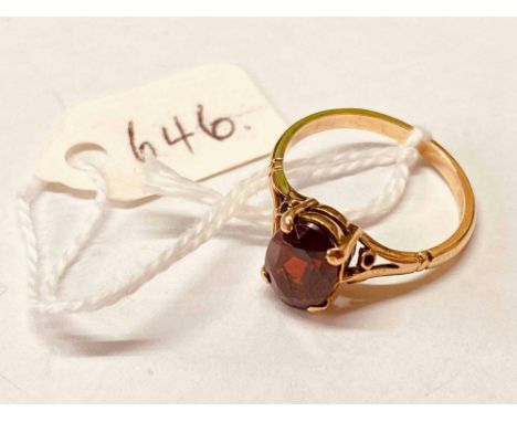 A oval garnet ring 9ct size M