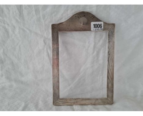 A arch topped photo frame with engine turned decoration 9 ½ inches high London 1919     120 gms