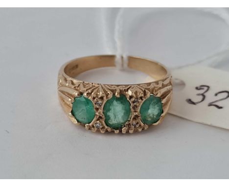 A seven stone emerald and diamond ring size M   3.1 gms