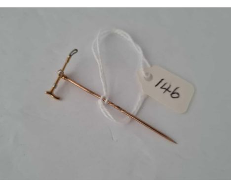 A high carat gold and platinum diamond set riding crop Stick Pin