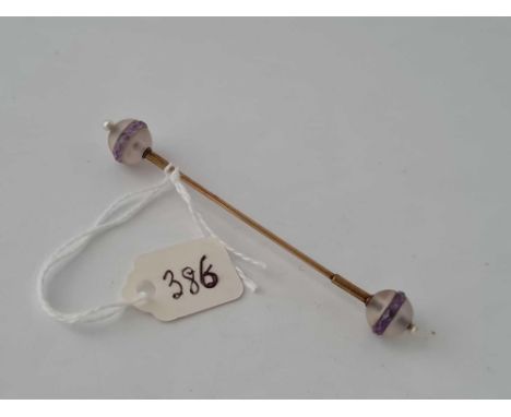 A cravat stick pin with crystal term 14ct gold