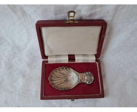 A boxed caddy spoon with shell decoration, Sheffield by FH