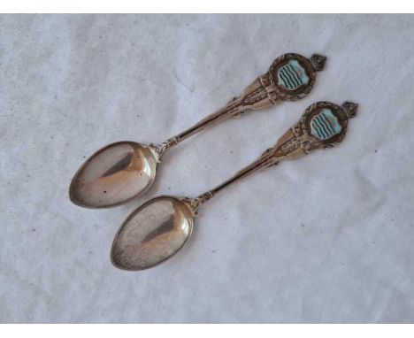 A pair of prize silver and enamel riffle spoons surmounted with a crown, Birmingham 1927, 45g