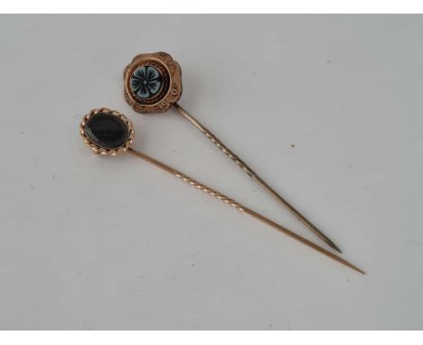 A gold mourning stick pin and one other