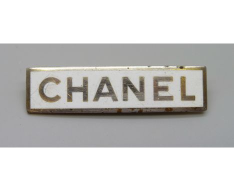 A vintage Chanel staff badge 