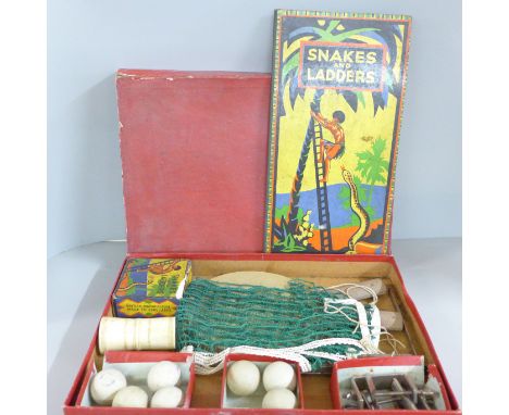 A table tennis set and vintage Snakes and Ladders board game 