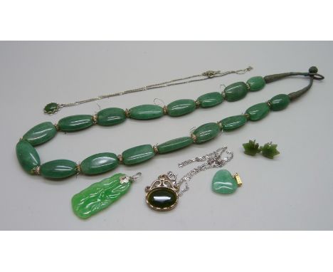 A collection of jade coloured jewellery 