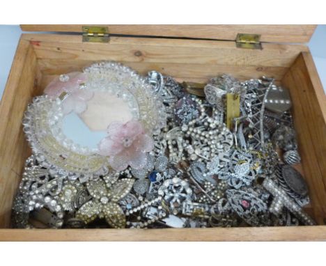 A collection of vintage jewellery, for spares or repair and a glass framed mirror 
