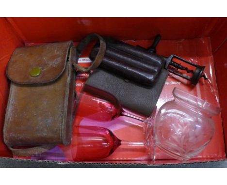 A folding camera, vintage corkscrew, a pair of cranberry glass wines, an etched glass pot, cigar case and wallet 