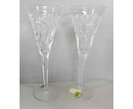 Waterford crystal; a boxed pair of tall toasting flutes, 'A Toast to The Year 2000', First Toast Happiness, complete with all