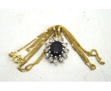 A 9ct gold sapphire and diamond cluster pendant, on a fine yellow metal chain, combined weight 2.6g