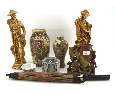 A collection of Chinese and Japanese items, including ceramic vases, a pair of figures, height up to 37.5cm, a parasol, and m