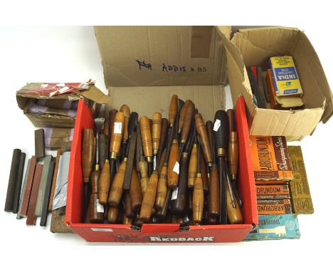 A large collection of vintage and contemporary carving tools and a selection of sharpening stones
