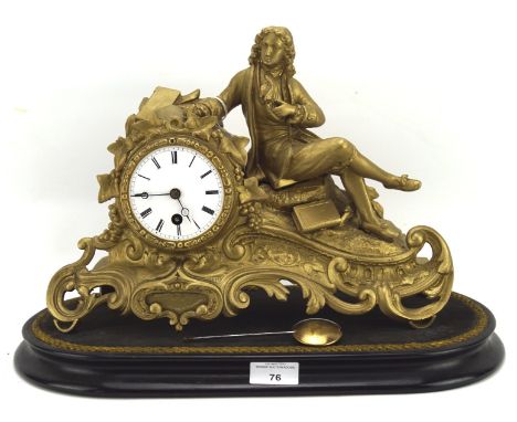A contemporary gilt mantle clock, the ceramic dial with Roman numerals, the case designed as a seated gentleman, mounted on a