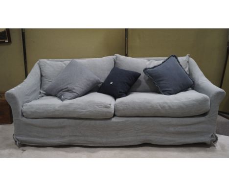A large pale blue three seater sofa with scatter cushions, 80cm x 212cm x 110cm