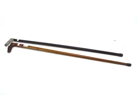A Malacca walking stick with horse head handle and a French rope twist handled three section cane