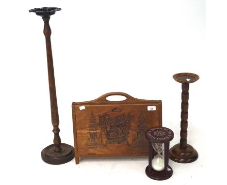 A selection of wooden wares, comprising two ash tray stands, both with turned supports, oriental carved magazine holder and a