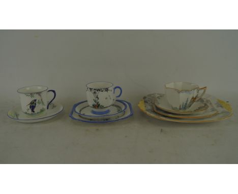 Two Shelley ceramic trios and a teacup with saucer, one trio having number '723404' to base, each with floral decoration