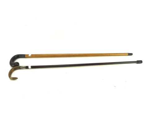 A malacca and horn handled walking stick and a silver-collared and horn handled cane, heights circa 89cm