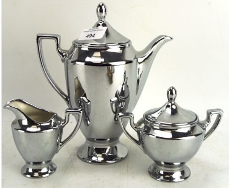 A vintage silver lustre ware ceramic part coffee set, comprising pot, sugar bowl and milk jug, the coffee pot measuring 21cm 