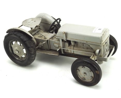 A tinplate model of a tractor, painted in grey, length 30cm