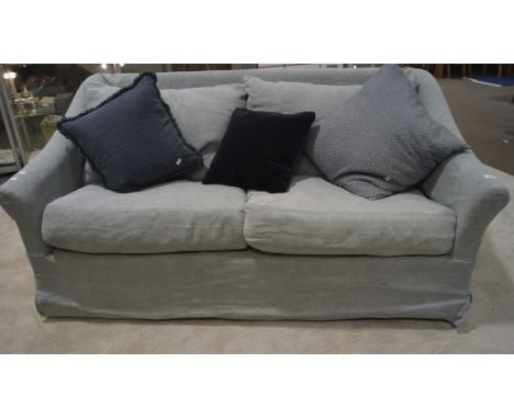A pale blue two-seater sofa with scatter cushions, 80cm x 95cm x 175cm