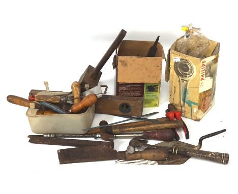 A box of assorted tools, including metal examples