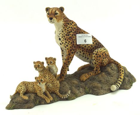 A Border ceramic sculpture of a cheetah family, on naturalistic base, height 18cm