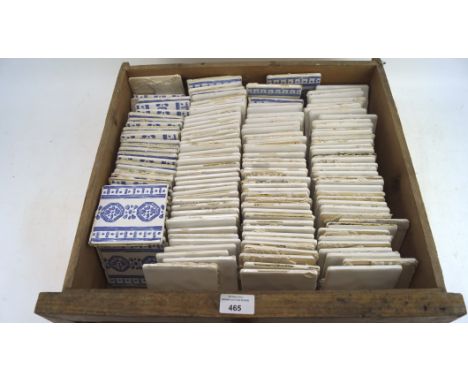 An extensive collection of Pilkington ceramic wall tiles, some having blue geometric decoration, the rest being plain white