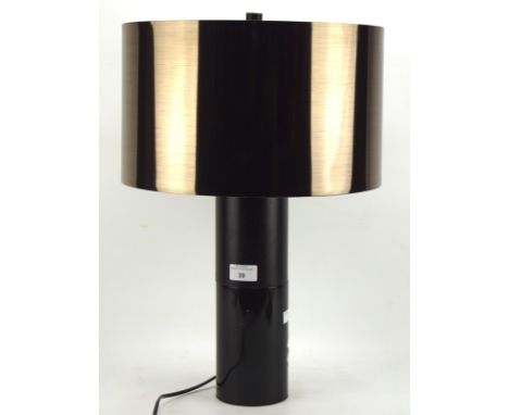 A contemporary table lamp, the brown metallic shade mounted on a ceramic and wooden stand, height (including shade) 53cm