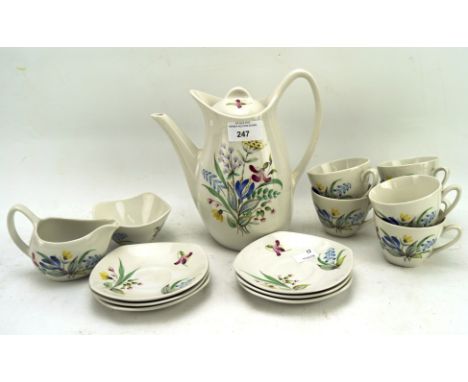 A Staffordshire Midwinter part tea service, comprising cups and saucers, a teapot, sugar bowl and cream jug