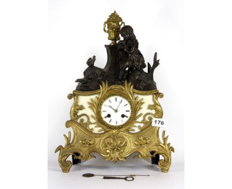 A mid 19th century French gilt spelter mantle clock with silk suspension, H. 40cm.