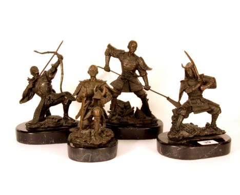 A 20th century set of four cast bronze figures of Japanese Samurai warriors on black marble bases, H. 23cm tallest.