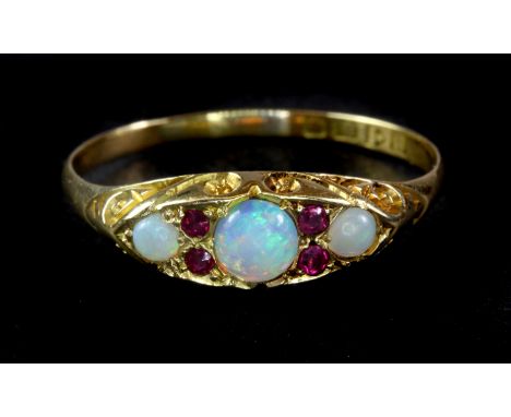 An antique 18ct yellow gold ruby and opal set ring, c. 1900, (T).