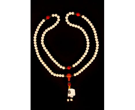 A single strand of Tibetan Buddhist prayer beads white glazed ceramic and other materials, 56cm.