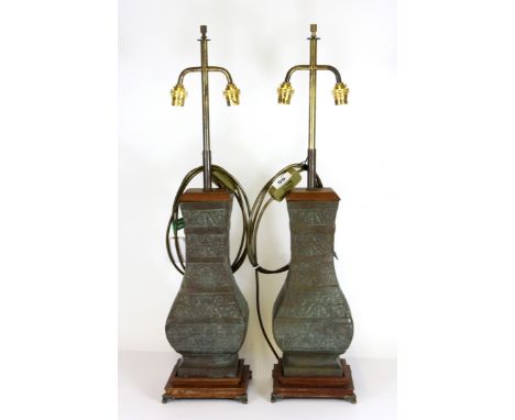 An impressive pair of Chinese style bronze vases mounted as table lamps, H. 70cm overall.