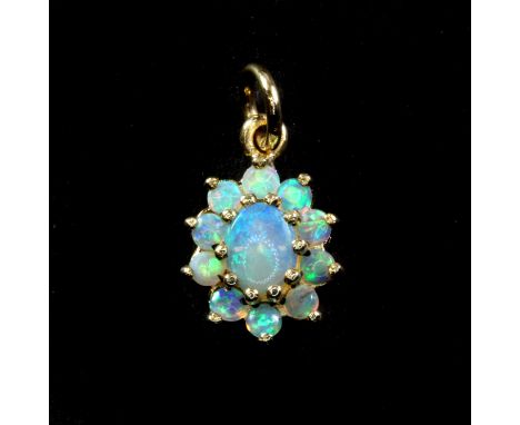 A yellow metal (tested 9ct gold) opal cluster pendant, L. 1.5cm.