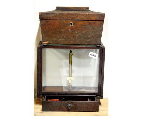 A Regency mahogany tea caddy and mahogany scale and weights.