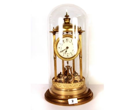 An early 20th century gilt brass anniversary clock under dome, H. 42cm.
