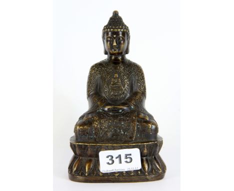 A well modelled Chinese cast bronze figure of a seated Buddha, H. 15cm.