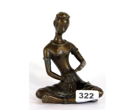 An early 20th century Nepalese / Tibetan bronze figure of a seated Deity, H. 15cm.