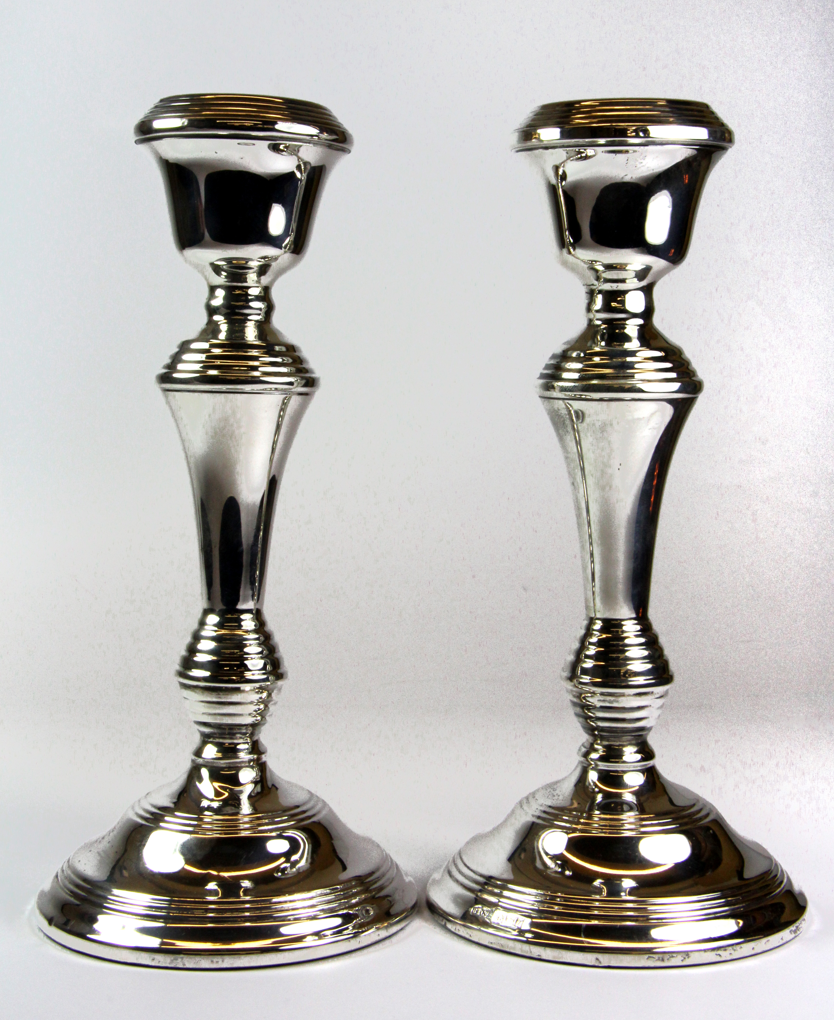 A pair of hallmarked silver candlesticks, H. 22cm.