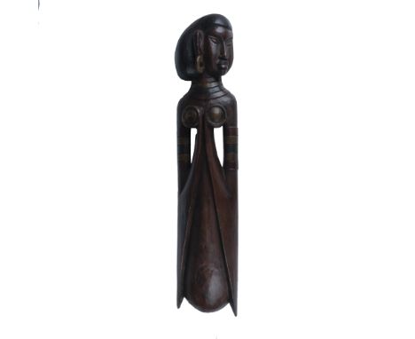 An exceptional tribal carving, masterfully crafted from dark wood and featuring intricately painted details. This unique piec