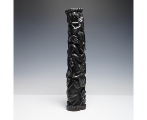Hand-carved African totem sculpture rendered in a dark hardwood, possibly ebony, featuring a vertical composition of interwov
