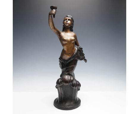 Elegant French bronze figural candlestick depicting a partially draped female figure with outstretched arm holding a cup-form