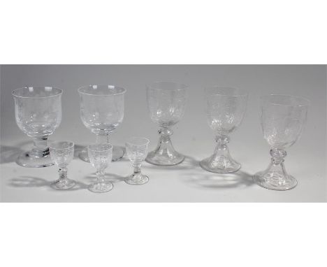 Selection of glasses to include wine and sherry glasses in cut glass and two glasses etched with a floral design and 'Congrat