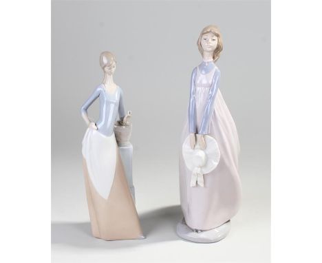 Two Nao porcelain figures, one holding a butterfly 28cm high, the other holding a hat 32cm high, (2)