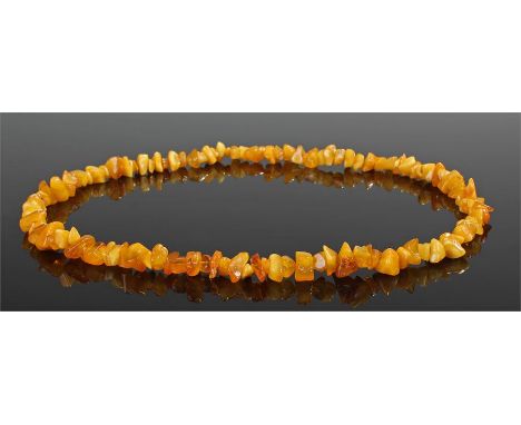 Butter scotch amber necklace, of pebble form, 65cm long, 44.4 grams