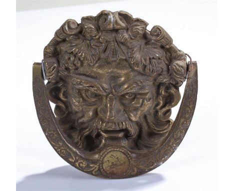 Gilt metal door knocker, as Bacchus with a swing arch handle, 13.5cm wide