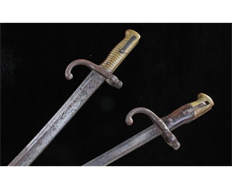 Two French bayonets, the first blade marked St Etienne 1870, the second St Etienne Mai 1879, (2)